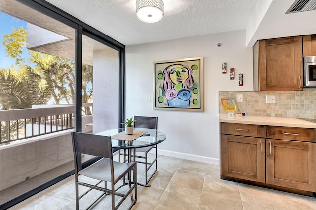 dining area with a textured ceiling