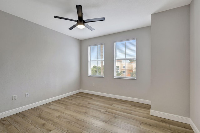 unfurnished room with ceiling fan and light hardwood / wood-style flooring