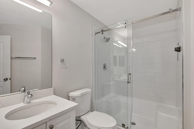 bathroom with vanity, toilet, and walk in shower