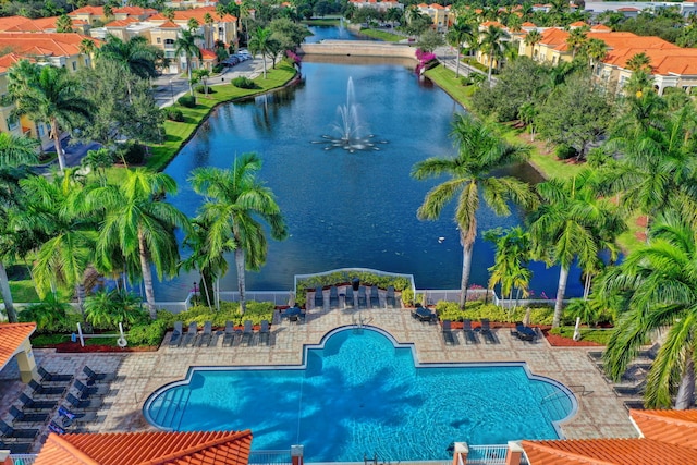 view of swimming pool with a water view