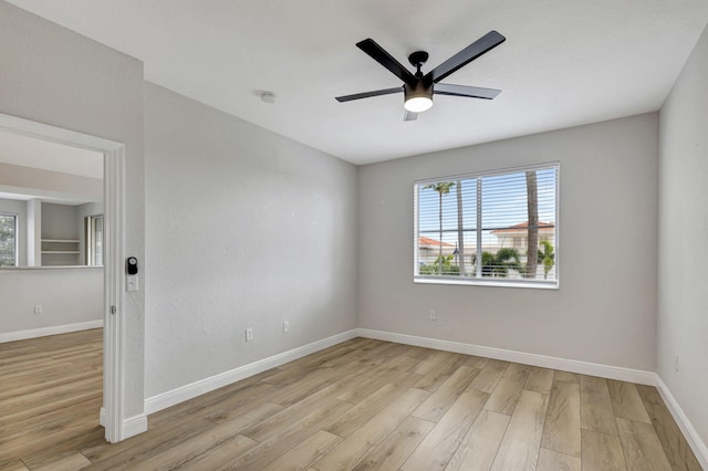 unfurnished room with ceiling fan and light hardwood / wood-style flooring