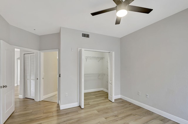 unfurnished bedroom featuring light hardwood / wood-style floors and ceiling fan