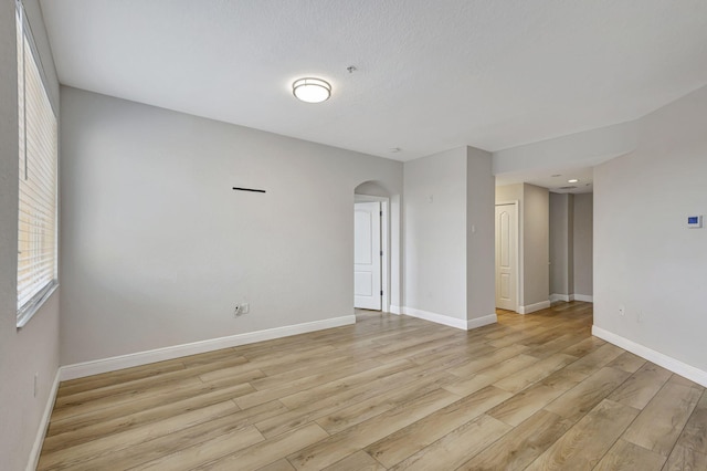 spare room with light hardwood / wood-style flooring