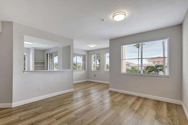 unfurnished room featuring light wood-type flooring