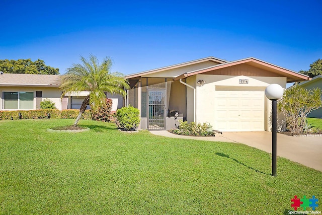 ranch-style house featuring a garage and a front yard