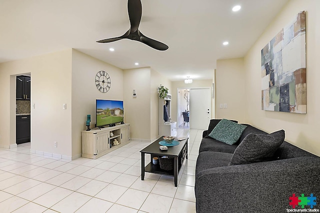 tiled living room with ceiling fan