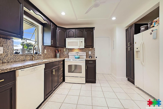 kitchen with white appliances, backsplash, ceiling fan, and sink