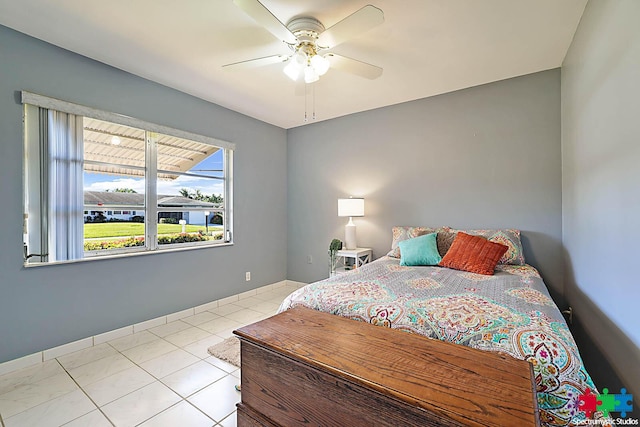 bedroom with light tile patterned floors and ceiling fan