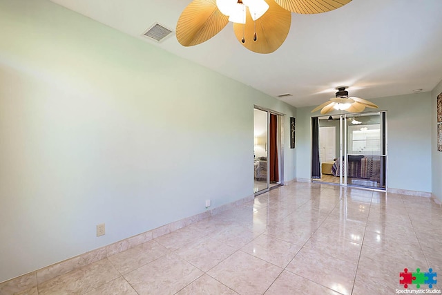 spare room with ceiling fan