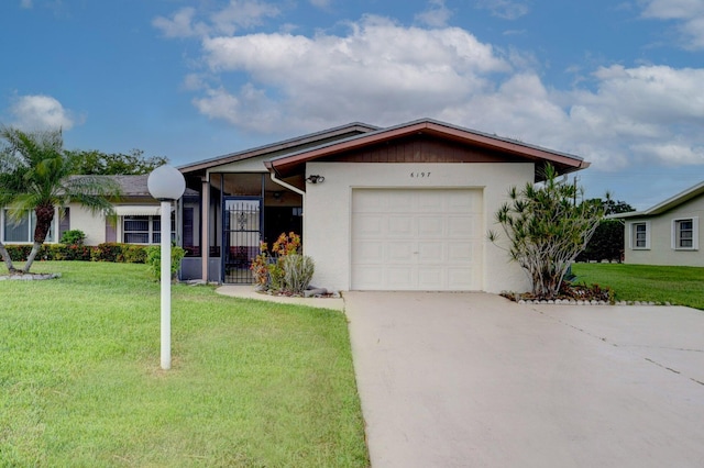 ranch-style home with a front yard and a garage