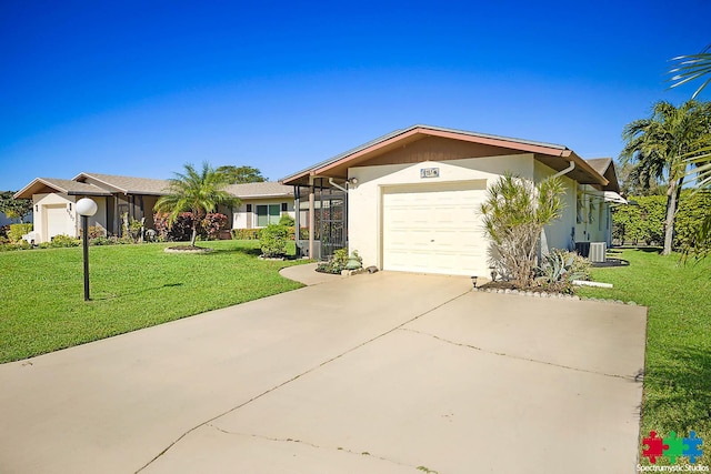 single story home with central AC unit, a garage, and a front lawn