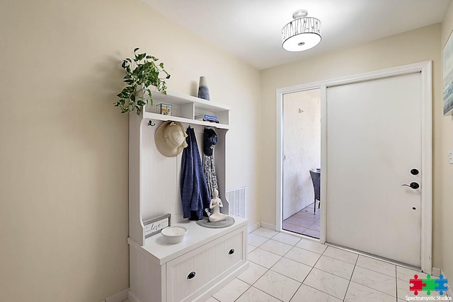 mudroom featuring light tile patterned floors