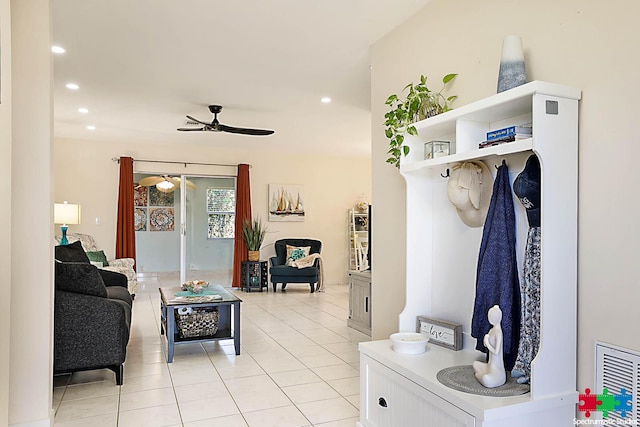 mudroom with light tile patterned floors and ceiling fan