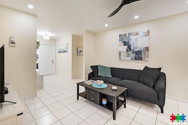 tiled living room featuring ceiling fan