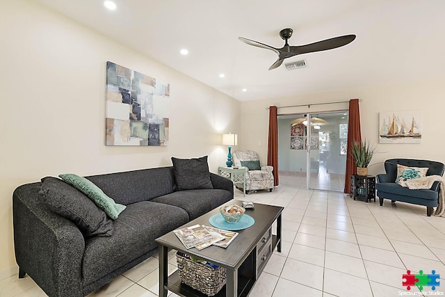 living room featuring ceiling fan and light tile patterned floors