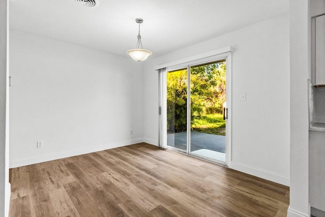 empty room featuring hardwood / wood-style flooring