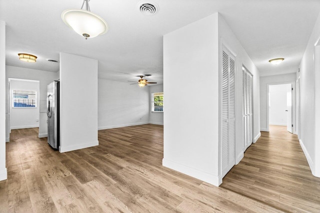 corridor featuring wood-type flooring