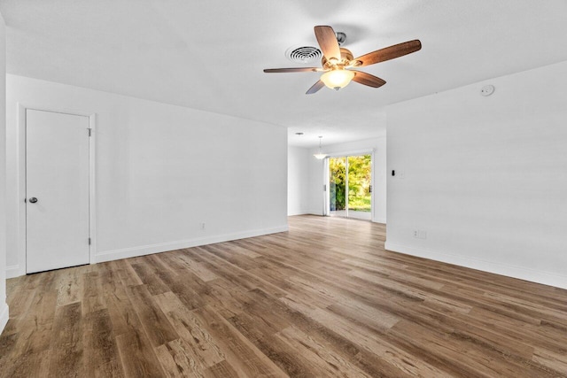 unfurnished room featuring hardwood / wood-style flooring and ceiling fan