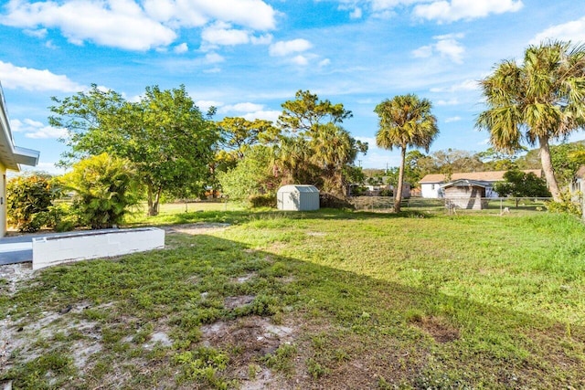 view of yard with a storage unit