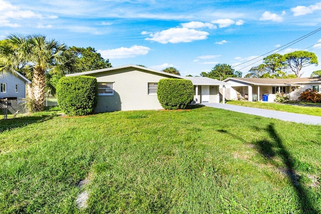 single story home with a front yard