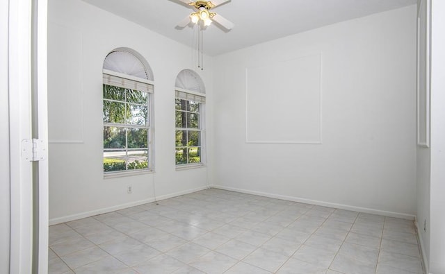 spare room featuring ceiling fan