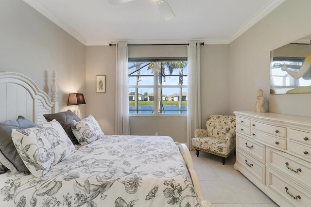 bedroom featuring ceiling fan, light tile patterned flooring, a water view, and crown molding