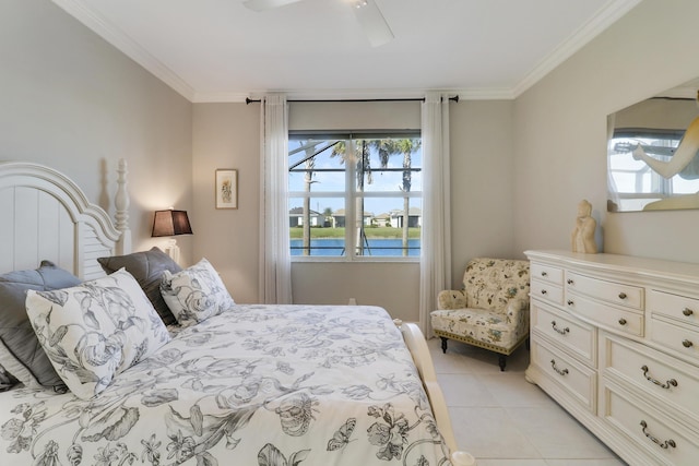 bedroom featuring a water view, ceiling fan, light tile patterned floors, and ornamental molding