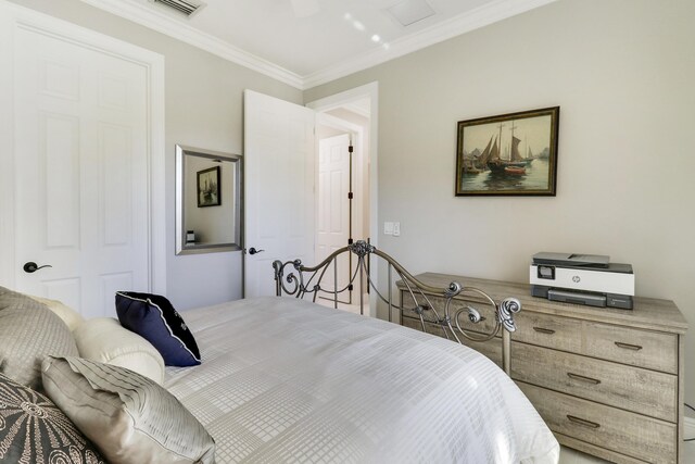 bedroom with ceiling fan, light tile patterned floors, and crown molding