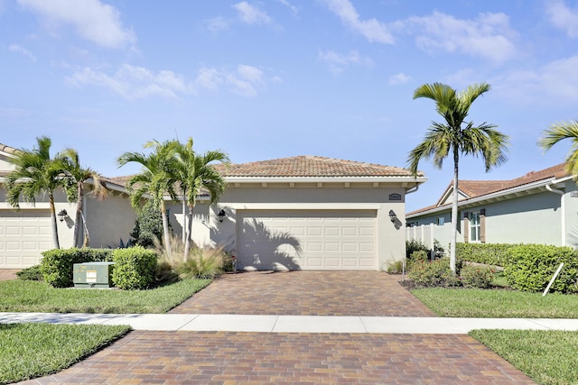 mediterranean / spanish house featuring a garage