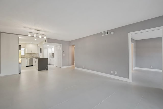 unfurnished living room with light tile patterned flooring