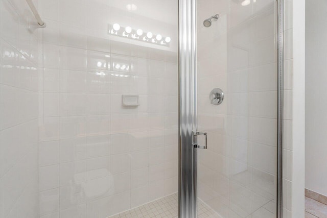 bathroom with a shower with shower door