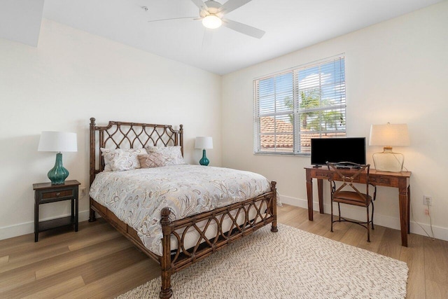 bedroom featuring ceiling fan and hardwood / wood-style flooring