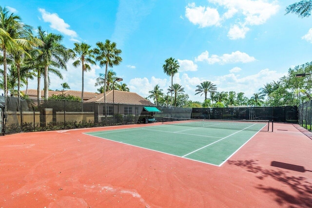 view of sport court with basketball hoop