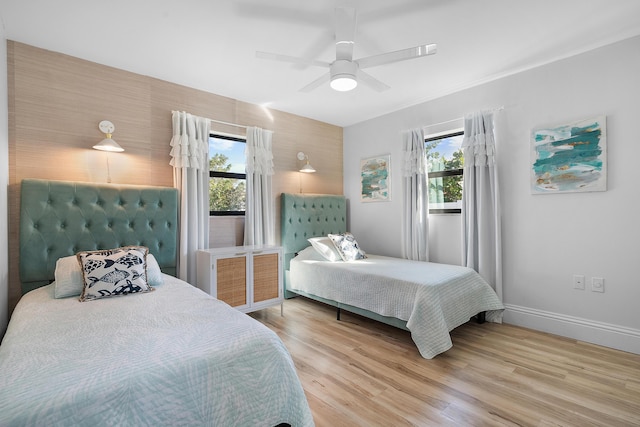 bedroom featuring hardwood / wood-style floors and ceiling fan