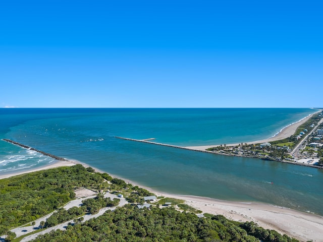 aerial view with a water view and a beach view