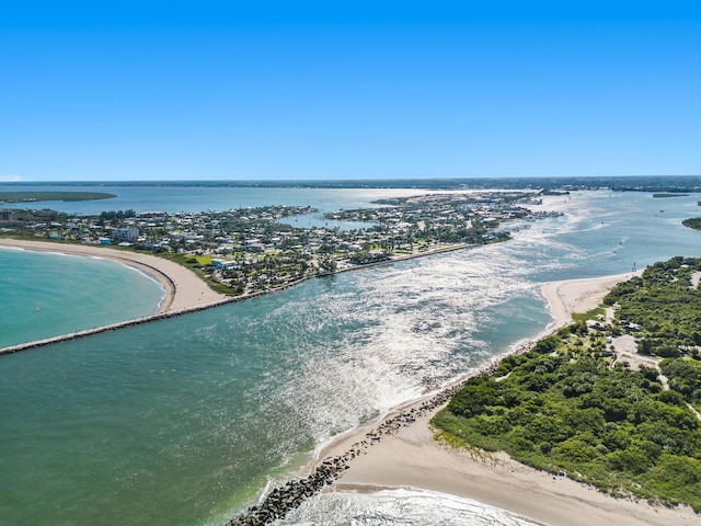 bird's eye view with a water view and a view of the beach