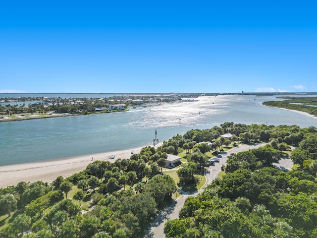 aerial view featuring a water view and a beach view