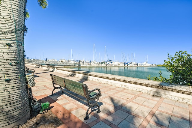 view of patio with a water view