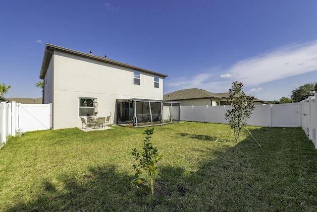 back of property featuring a lawn