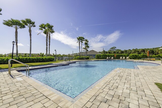 view of swimming pool with a patio area