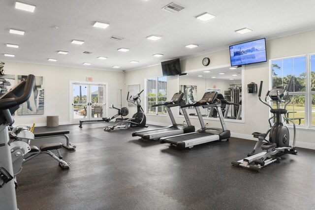 gym featuring crown molding