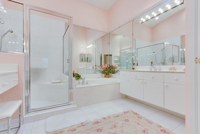 bathroom with vanity, tile patterned floors, and independent shower and bath