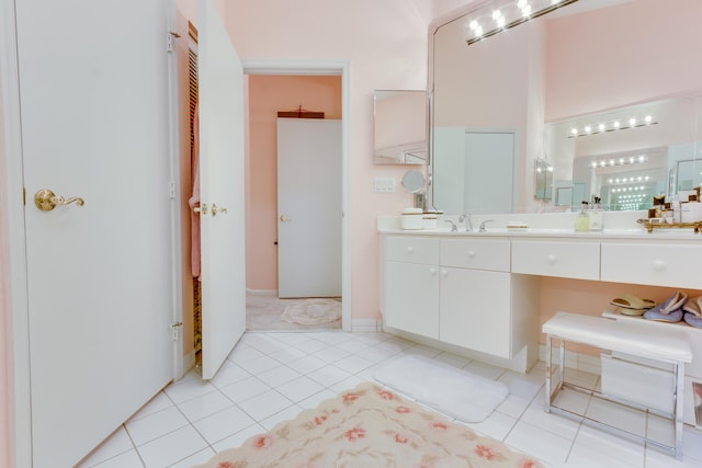 bathroom featuring tile patterned flooring and vanity