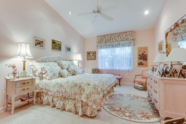 carpeted bedroom featuring high vaulted ceiling and ceiling fan