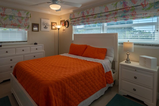 bedroom with ornamental molding and ceiling fan