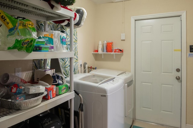 washroom featuring independent washer and dryer