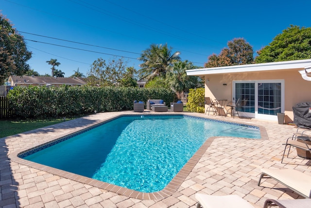 view of pool featuring a patio area