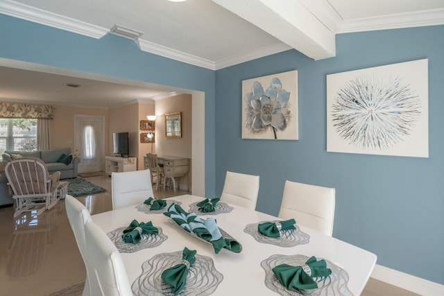 dining area with ornamental molding and beam ceiling