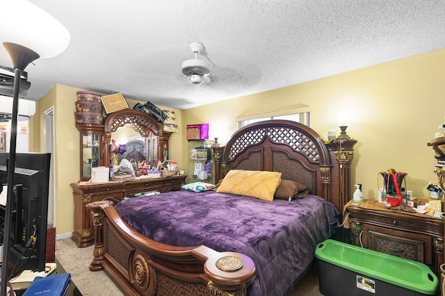 carpeted bedroom featuring a textured ceiling