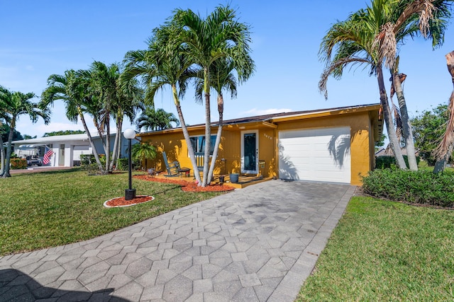 ranch-style house with a front lawn and a garage